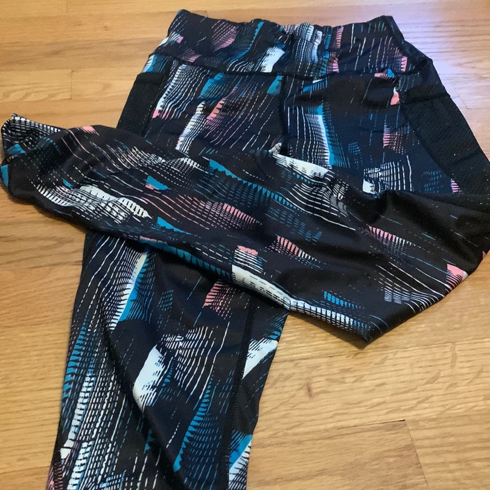 Thin fabric leggings. Multi colored details. Pockets. Size small.